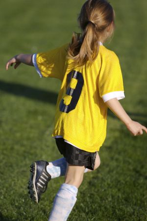 Soccer Girl Running the Field